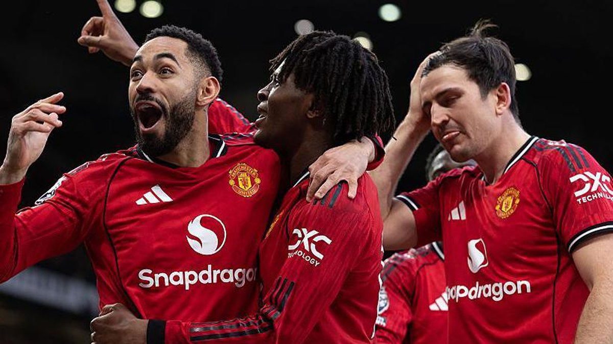 Manchester United players celebrate a goal at Old Trafford