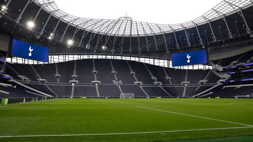 Wide view of Tottenham Hotspur Stadium stands and pitch during daylight