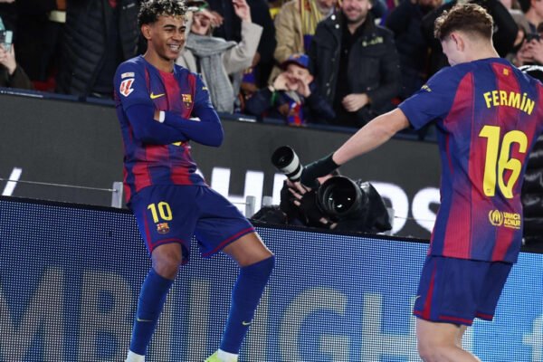 Lamine Yamal celebrates in heavy rain at Camp Nou