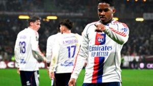 Endrick celebrates after scoring for Lyon during a night match