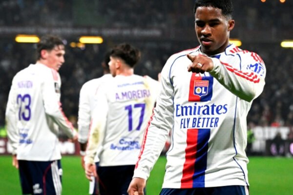 Endrick celebrates after scoring for Lyon during a night match