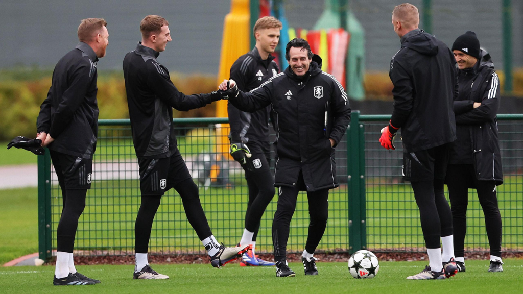 Unai Emery coaching Aston Villa players during a training session, giving tactical instructions on the pitch.