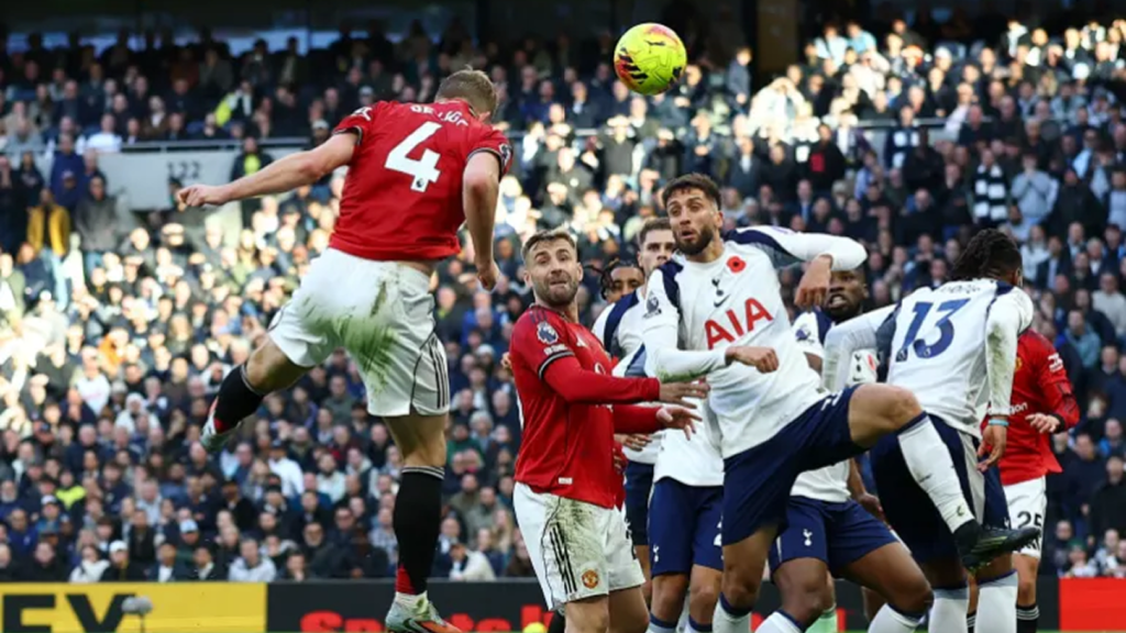 Tottenham players involved in a defensive duel during a Premier League match