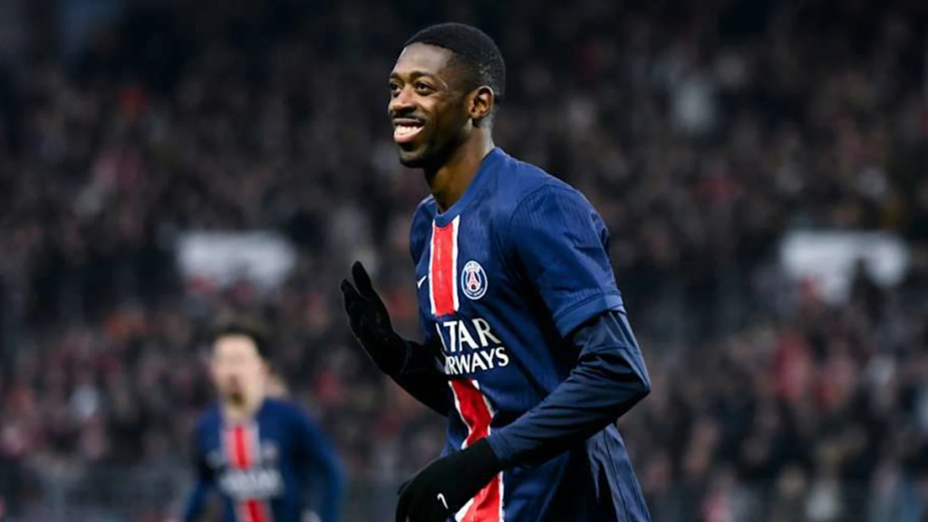 Close-up of Ousmane Dembélé’s focused facial expression during a match, showing concentration and determination