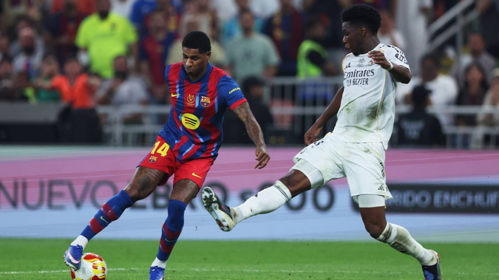 Marcus Rashford dribbles past Aurélien Tchouaméni during Barcelona’s Supercopa clash with Real Madrid