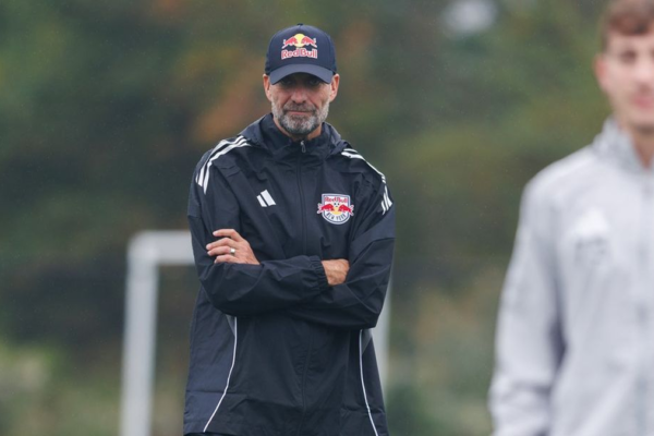 Jürgen Klopp standing on the side during an RB Leipzig training session, focused on the players