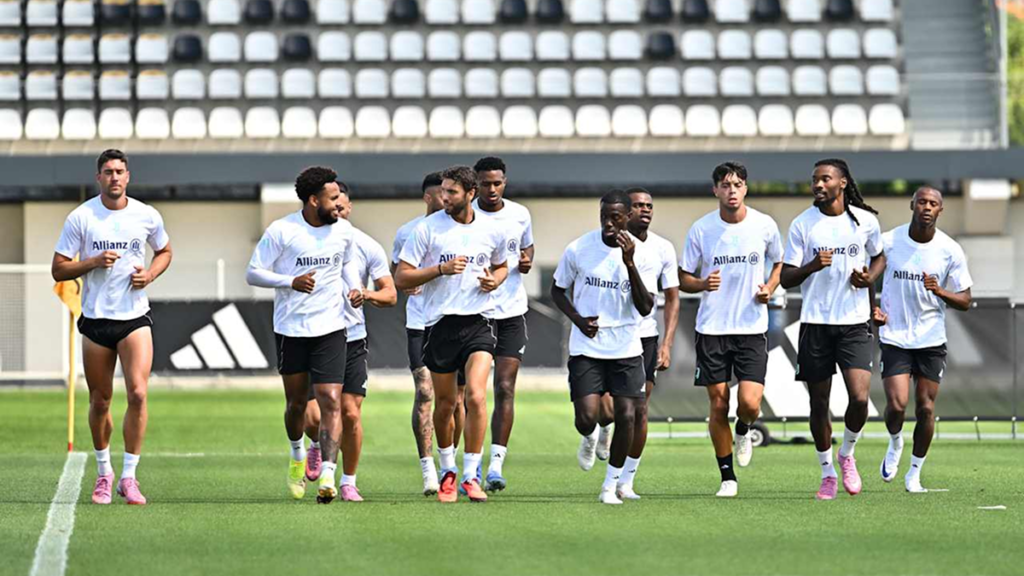 Juventus players in a team training session, practicing tactical drills and ball control