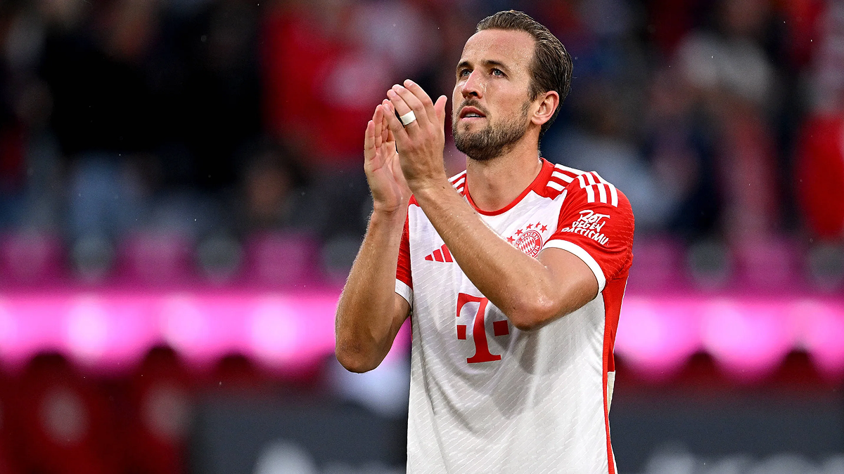 Harry Kane applauding the crowd after the match, showing focus and intensity.