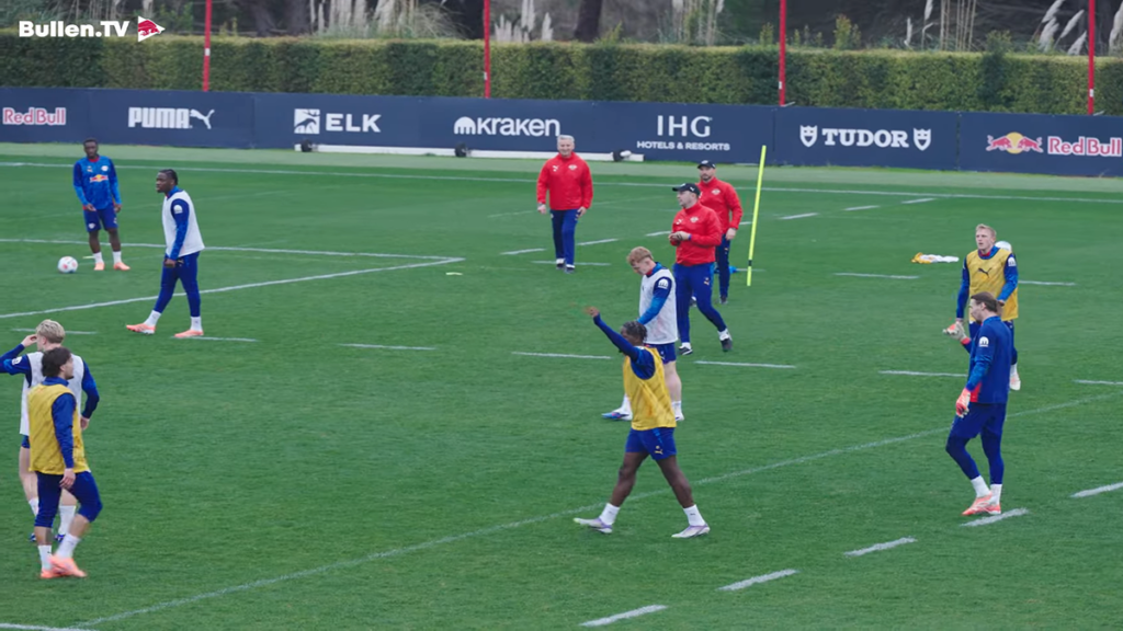 RB Leipzig players practicing drills during a team training session on the pitch