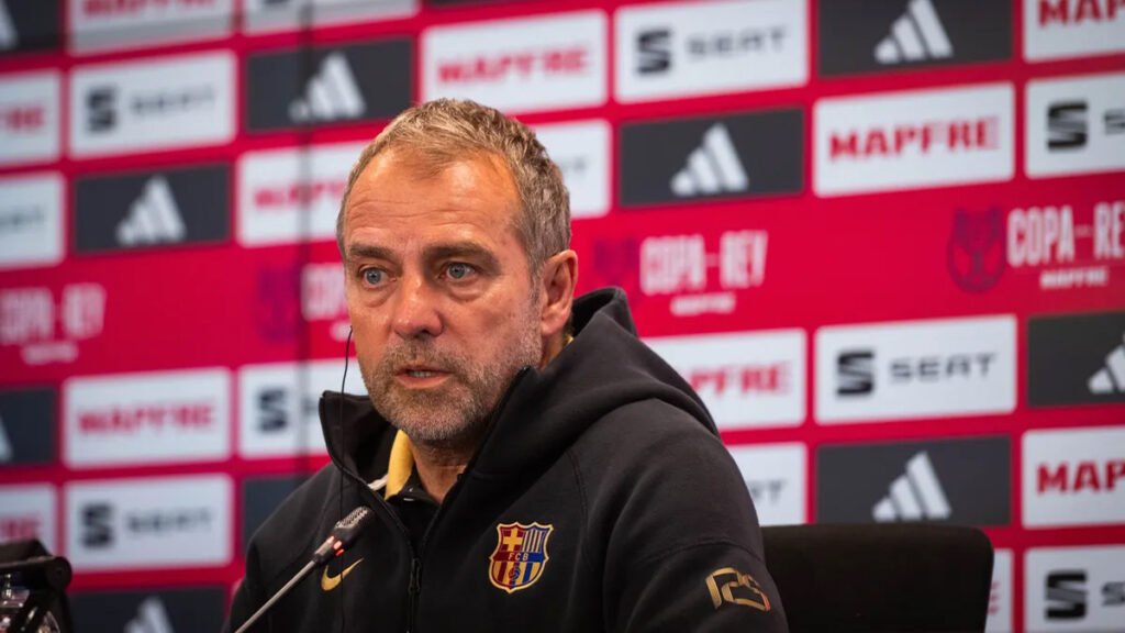 Hansi Flick speaks at press conference with Barcelona backdrop behind