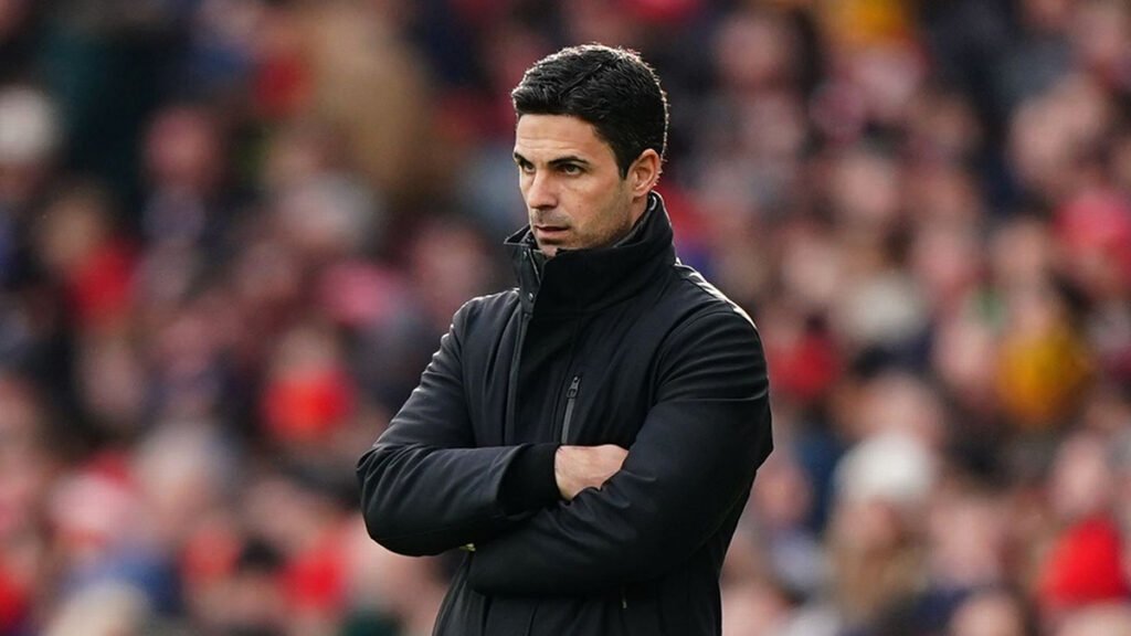 Arteta watches from touchline during a Premier League game