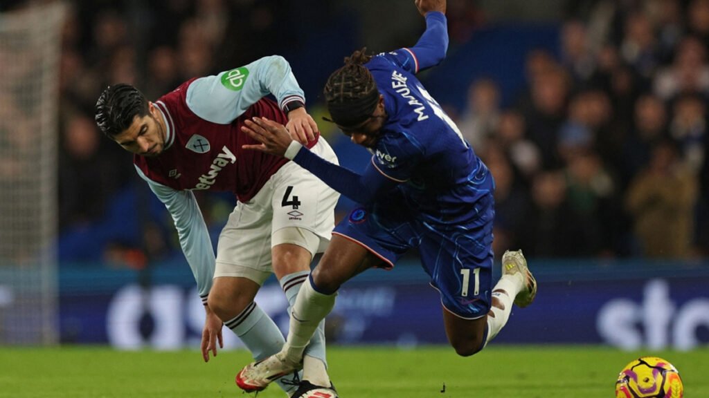 Chelsea and West Ham players contest the ball at Stamford Bridge.