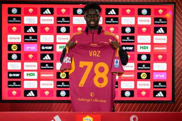 AS Roma’s Robinio Vaz holds up his shirt during his presentation after joining the club.
