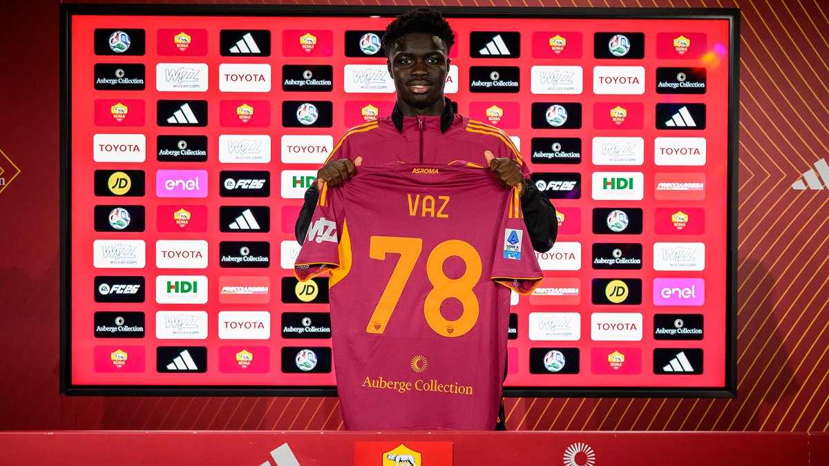 AS Roma’s Robinio Vaz holds up his shirt during his presentation after joining the club.