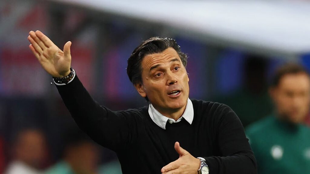 Vincenzo Montella on the touchline during an international match, pointing and shouting instructions.