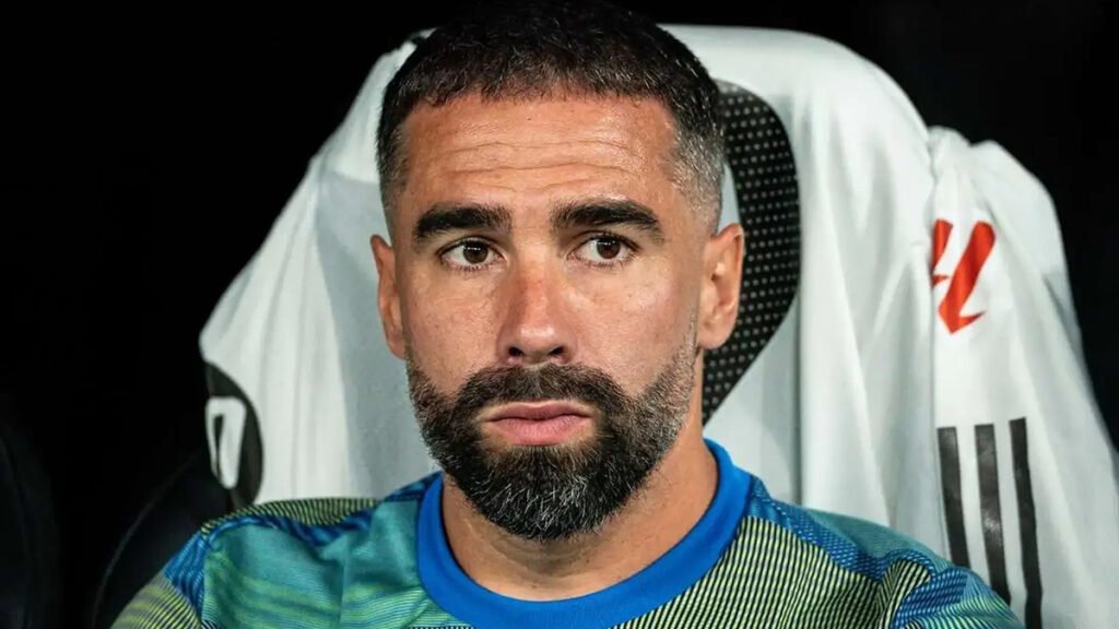 Dani Carvajal sits on the bench during Real Madrid’s match as selection options are weighed