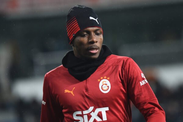 Victor Osimhen warms up in a Galatasaray kit ahead of a Champions League match.
